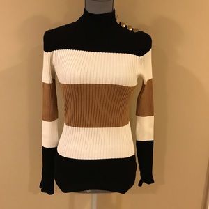 INC black, cream, and brown fitted top.Size medium